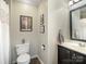 Cozy bathroom with black vanity and a shower with curtain, providing a comfortable space at 1506 Crestdale Rd, Rock Hill, SC 29732