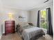Light bedroom featuring neutral colors, a window, and a dark wood dresser set at 1506 Crestdale Rd, Rock Hill, SC 29732