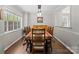 Elegant dining room with wood floors, stylish lighting, and seating for six at 1506 Crestdale Rd, Rock Hill, SC 29732