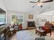 Cozy living room with brick fireplace, hardwood floors, and large windows offering natural light at 1506 Crestdale Rd, Rock Hill, SC 29732