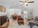 Open living room with fireplace, hardwood floors, and a view into the dining area at 1506 Crestdale Rd, Rock Hill, SC 29732