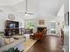 Inviting living room with vaulted ceiling, fireplace, comfortable seating, and ample natural light at 1506 Crestdale Rd, Rock Hill, SC 29732