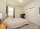 Relaxing bedroom with a soft carpet, neutral colors, and a double-door closet at 1516 Laggan Ln, Indian Trail, NC 28079