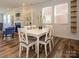 Cozy dining area with a fireplace, built-in shelving, and ample natural light at 1516 Laggan Ln, Indian Trail, NC 28079