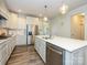 Spacious kitchen featuring a large island, stainless steel appliances, and white cabinets at 1516 Laggan Ln, Indian Trail, NC 28079
