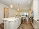 Open-concept kitchen featuring a central island, modern fixtures, and seamless flow into the dining area at 1516 Laggan Ln, Indian Trail, NC 28079