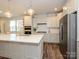Well-equipped kitchen with an island, pendant lighting, and stainless steel appliances at 1516 Laggan Ln, Indian Trail, NC 28079