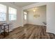 Bright living room with wood floors and a large window for natural light at 1516 Laggan Ln, Indian Trail, NC 28079