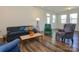 Bright living room with hardwood floors, a large window, and comfortable seating at 1516 Laggan Ln, Indian Trail, NC 28079