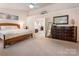 Primary bedroom with neutral colored walls, carpeted floors and natural light at 16219 Long Talon Way, Charlotte, NC 28273