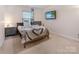 Cozy bedroom with twin bed, nightstand, and mounted TV at 16219 Long Talon Way, Charlotte, NC 28273