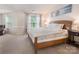 Primary bedroom boasts a large bed, natural light and neutral colored walls at 16219 Long Talon Way, Charlotte, NC 28273