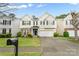 Charming two-story home with stone accents, blue shutters, well-manicured lawn and two car garage at 16219 Long Talon Way, Charlotte, NC 28273