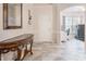 Inviting foyer with stylish console table and an arched doorway to the office at 16219 Long Talon Way, Charlotte, NC 28273