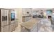 Open kitchen with granite countertops, stainless steel appliances and a view to the living area at 16219 Long Talon Way, Charlotte, NC 28273