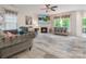 Relaxing living room with a modern fireplace, neutral decor, and backyard view at 16219 Long Talon Way, Charlotte, NC 28273