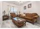 Cozy living room features decorative fireplace, chandelier lighting and light airy decor at 16219 Long Talon Way, Charlotte, NC 28273