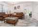 Spacious living room showcasing tile floors, classic furnishings, and a large arched doorway at 16219 Long Talon Way, Charlotte, NC 28273