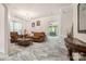 Elegant living room featuring tile floors, classic furnishings, and abundant natural light at 16219 Long Talon Way, Charlotte, NC 28273