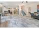Open-concept living area seamlessly connects to the modern kitchen and staircase at 16219 Long Talon Way, Charlotte, NC 28273