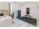 Bright office space with a treadmill, desk area, and natural light at 16219 Long Talon Way, Charlotte, NC 28273
