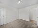 A carpeted bedroom with neutral walls leads to additional rooms at 1762 Tate Rd, Rock Hill, SC 29732