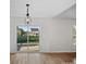 Bright dining area with modern chandelier and sliding glass doors to the backyard at 1762 Tate Rd, Rock Hill, SC 29732