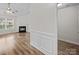 Spacious living room with a fireplace, hardwood floors, and custom wall paneling at 1762 Tate Rd, Rock Hill, SC 29732