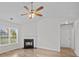 Cozy living room featuring a fireplace with black hearth, neutral walls, and wood flooring at 1762 Tate Rd, Rock Hill, SC 29732