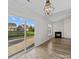 Bright living room featuring a fireplace, sliding glass doors to backyard, and wood flooring at 1762 Tate Rd, Rock Hill, SC 29732