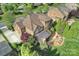 An aerial view highlights the home's expansive lot, screened porch, solar panels and beautifully landscaped backyard at 2001 Arundale Ln, Matthews, NC 28104