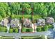 Aerial view of a private residence with manicured lawns and surrounded by mature trees at 2001 Arundale Ln, Matthews, NC 28104