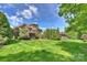 Expansive backyard featuring a lush lawn, mature trees, and beautifully landscaped areas, perfect for outdoor enjoyment at 2001 Arundale Ln, Matthews, NC 28104