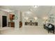 Living area featuring a wet bar, unique artwork and comfortable seating at 2001 Arundale Ln, Matthews, NC 28104