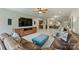 Open living area with a media center, wet bar, and cozy seating at 2001 Arundale Ln, Matthews, NC 28104