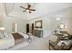 Bright main bedroom with tray ceilings, carpet, a large dresser, and sitting area for relaxing at 2001 Arundale Ln, Matthews, NC 28104