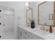 Bright bathroom featuring a double vanity with quartz counters, decorative mirrors, and shower at 2165 Country Club Rd, Lincolnton, NC 28092