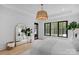 Bright bedroom with hardwood floors, black framed windows, and large mirror at 2165 Country Club Rd, Lincolnton, NC 28092