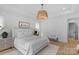 Bright bedroom featuring black framed windows and hardwood floors at 2165 Country Club Rd, Lincolnton, NC 28092