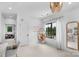 Cozy bedroom with a hanging chair, chandelier, and neutral decor at 2165 Country Club Rd, Lincolnton, NC 28092