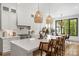 Bright and airy kitchen features a large island, pendant lighting, and stainless steel appliances at 2165 Country Club Rd, Lincolnton, NC 28092