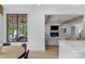 Open-concept kitchen with quartz counters, a view to the living room, and wood beam accents at 2165 Country Club Rd, Lincolnton, NC 28092