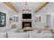 Elegant living room with coffered ceiling, built-in cabinets, fireplace, and ample natural light at 2165 Country Club Rd, Lincolnton, NC 28092