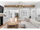 Open-concept living space featuring wood floors, a fireplace, built-ins, and an elegant chandelier at 2165 Country Club Rd, Lincolnton, NC 28092
