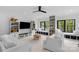 Spacious living room with built-in shelving, window seats, and a ceiling fan at 2165 Country Club Rd, Lincolnton, NC 28092