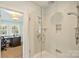 Clean bathroom featuring a glass-enclosed shower with chrome fixtures and white tiling at 2229 Kenmore Ave, Charlotte, NC 28204