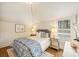 Cozy bedroom with a patterned quilt, bedside tables, lamps, and plantation shutters at 2229 Kenmore Ave, Charlotte, NC 28204