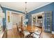 Stylish dining room featuring a large wooden table, chandelier, and ample seating, ideal for entertaining and Gathering gatherings at 2229 Kenmore Ave, Charlotte, NC 28204