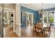 Elegant dining room featuring hardwood floors, blue walls, and a chandelier, perfect for hosting dinner parties and Gathering gatherings at 2229 Kenmore Ave, Charlotte, NC 28204