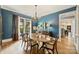 Bright dining room with hardwood floors, a large window, and elegant furnishings, perfect for enjoying meals and entertaining guests at 2229 Kenmore Ave, Charlotte, NC 28204